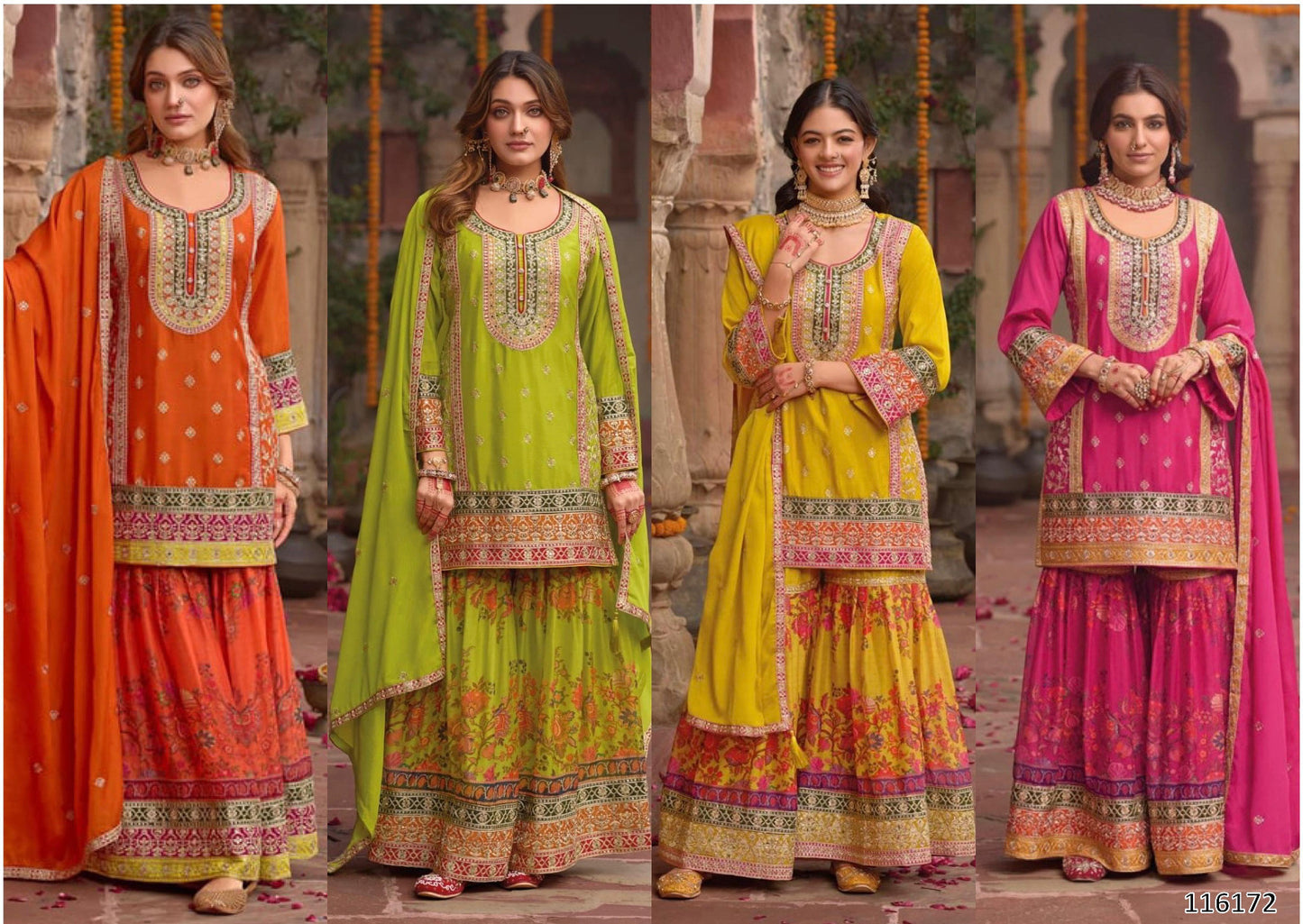 Four women wearing colorful traditional outfits with intricate patterns in an outdoor setting.