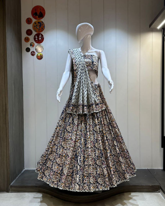 Mannequin wearing a patterned dress in a store setting with decorative elements on the wall.