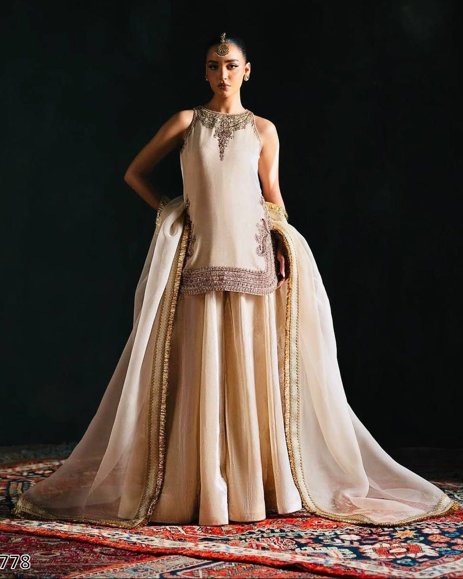 Woman in a traditional outfit with a dark background