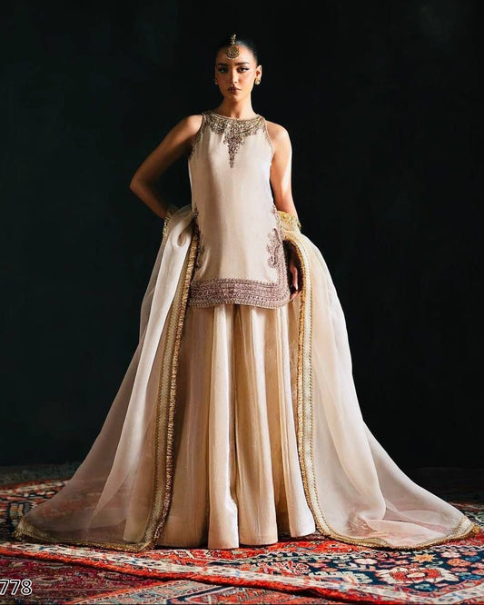 Woman in a traditional outfit with a dark background