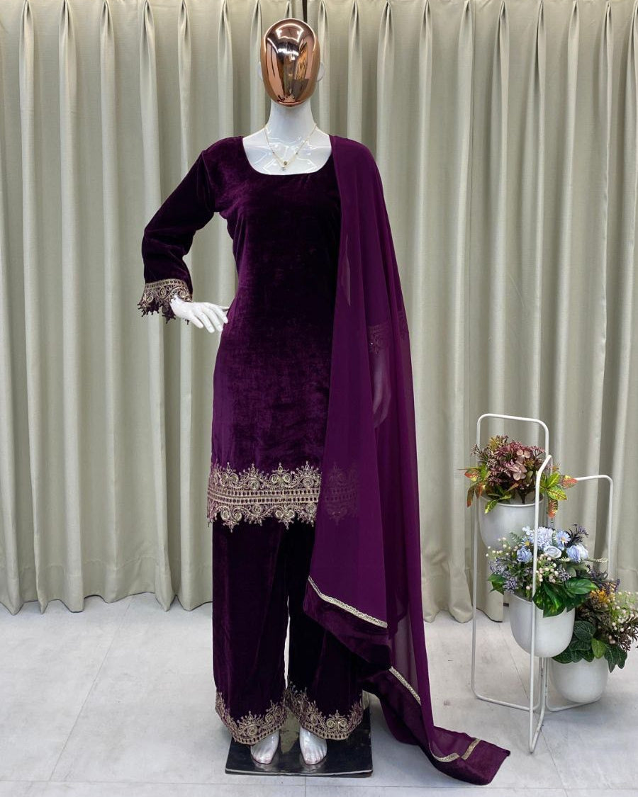 Mannequin wearing a purple traditional outfit with a draped fabric against a neutral background