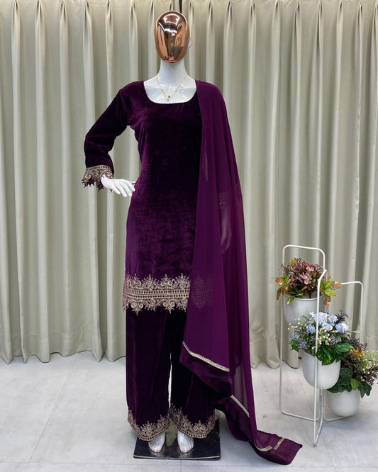 Mannequin wearing a purple traditional outfit with a draped fabric against a neutral background